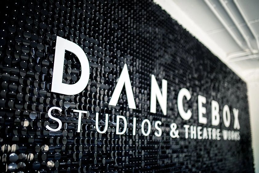 Black sequin wall with signage at Dancebox Studios