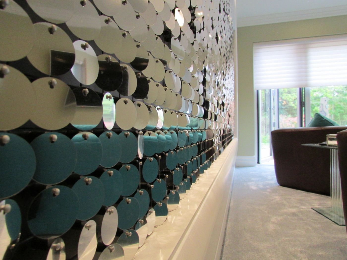 Sculpted disc feature wall in a hallway